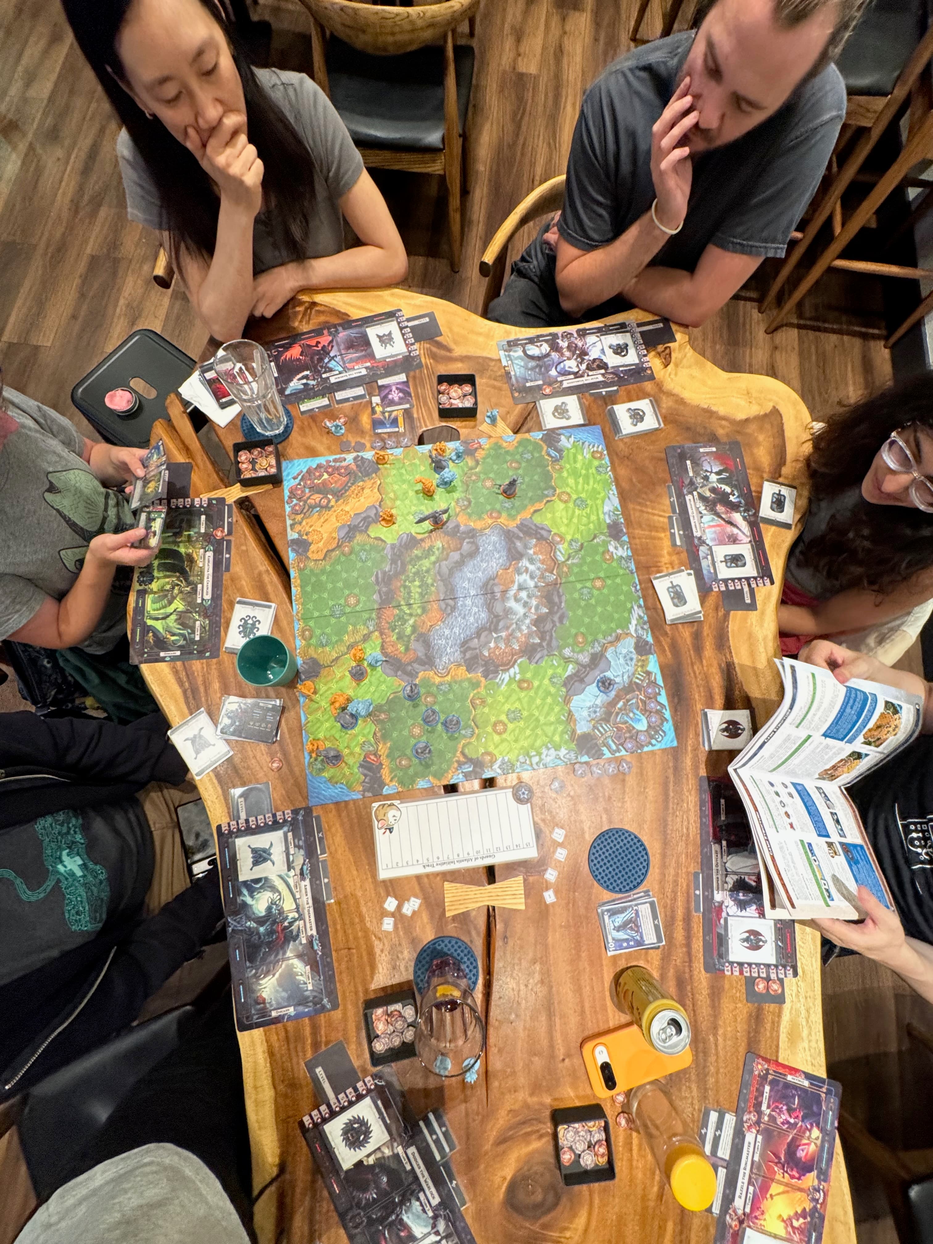 A strategy game mid-play on the live-edge table